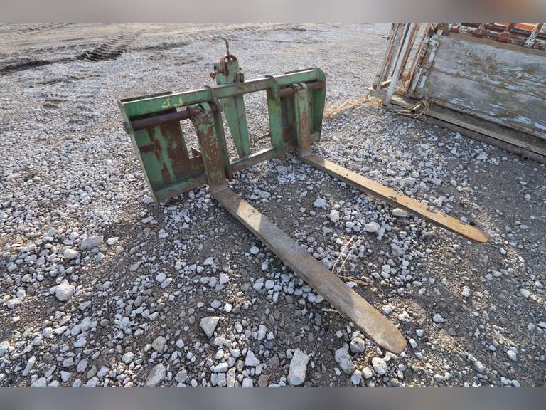 John Deere loader forks with custom welded brackets for Koyker loader