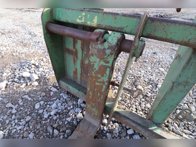 John Deere loader forks with custom welded brackets for Koyker loader