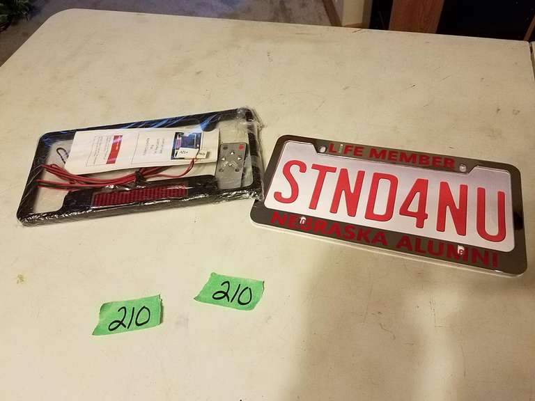 Two License Plate Holders Adam Marshall Land & Auction, LLC