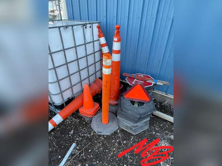 Orange traffic cones, candles, flagman stop sign/flags, slow moving