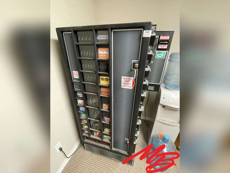 Coin Operated Vending Machine snacks and soda pop has dollar bill