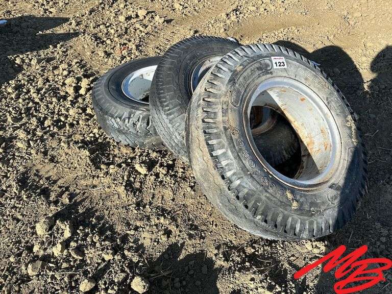 (3) 10.0020 Tires on Split Rims Musser Bros Inc