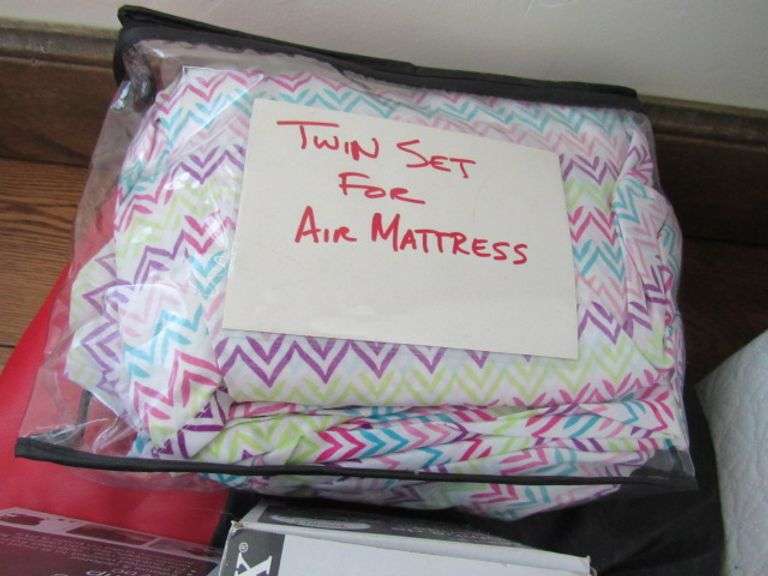 TWIN BLOW UP AIR MATTRESS WITH COLORFUL SHEETS McPherson Auction & Realty
