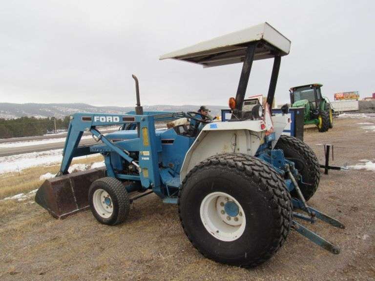 FORD 2120 TURF DIESEL TRACTOR W/7109 LOADER 6' BUCKET HAS 3 POINT 4 WHEEL DRIVE, 3 CYLINDER