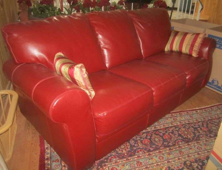 Red leather hideabed sofa Mark Van Hook, Auctioneer