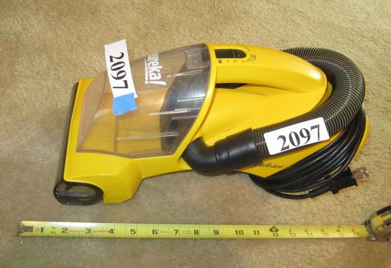 Eureka handheld vacuum with extra filters Mark Van Hook, Auctioneer