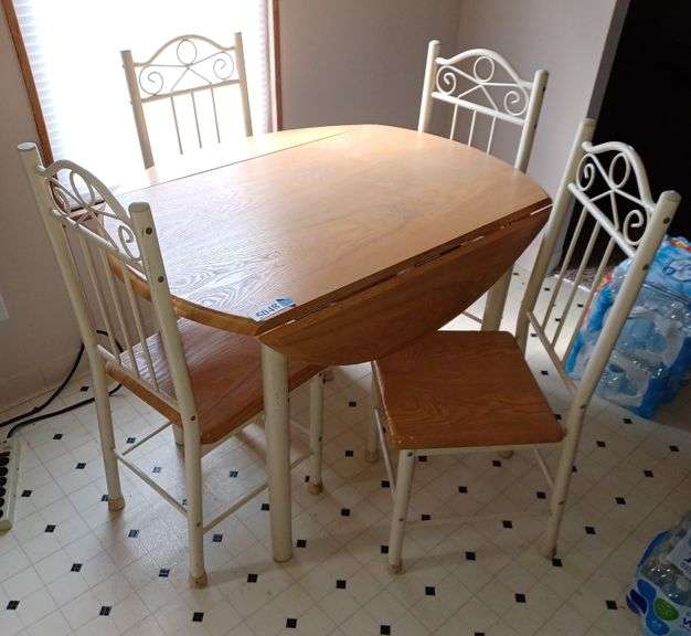 Drop leaf kitchen table and four chairs. Mark Van Hook, Auctioneer