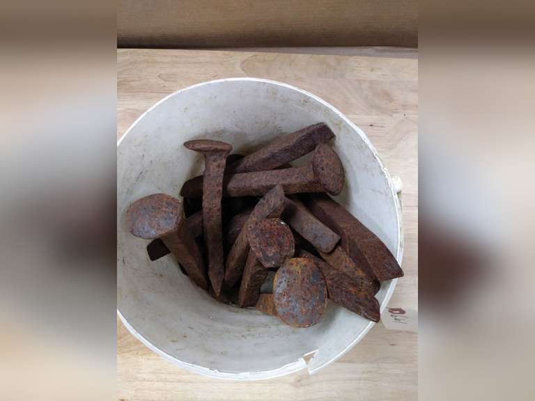 Bucket of railroad spikes Northern Kentucky Auction, LLC