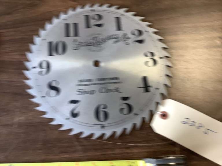 Sears & Roebuck shop clock face made from a saw blade.