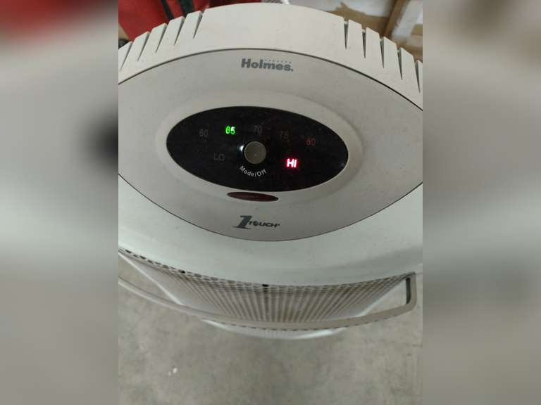 Holmes tower quartz heater. Powered on.