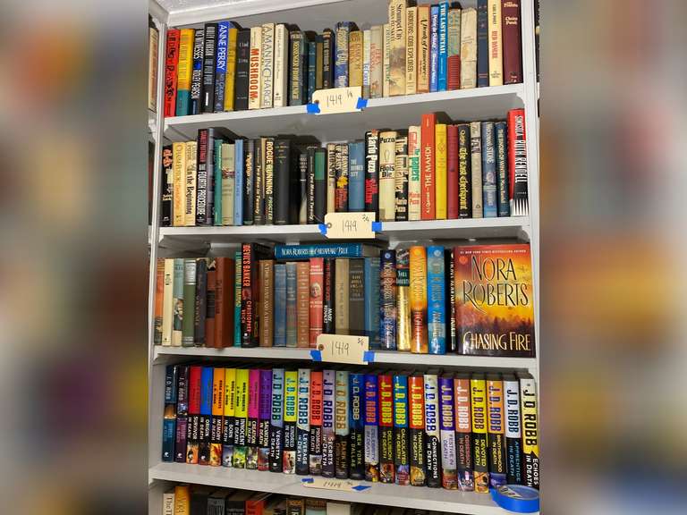 Four shelves full of books, must bring them boxes to pack. Books do not