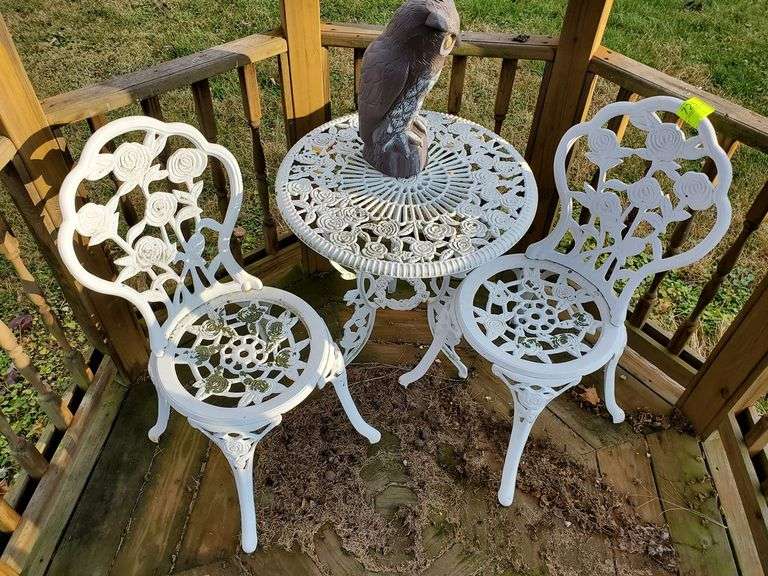 Cast metal outdoor ice cream parlor table with floral design Parrott