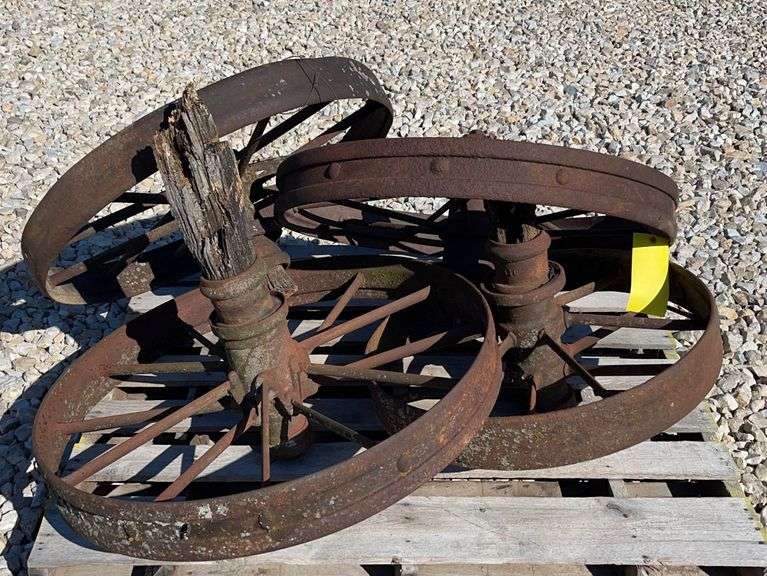4 antique iron wheels Schneider Auctioneers LLC