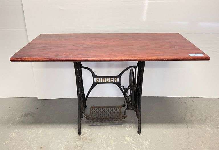 Table made from antique sewing machine base Schneider Auctioneers LLC