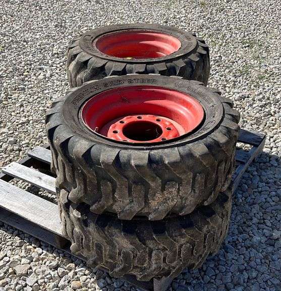 4 used 1016 skid steer tires on rims Schneider Auctioneers LLC