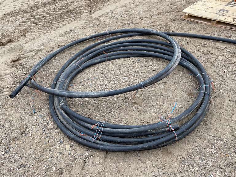 Roll of Used 1.5 inch black water pipe Smith Sales Co. Auctioneers