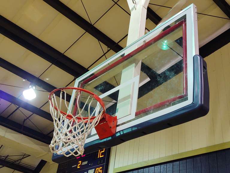 2 regulation glass back basketball goals by Gared. South Auction