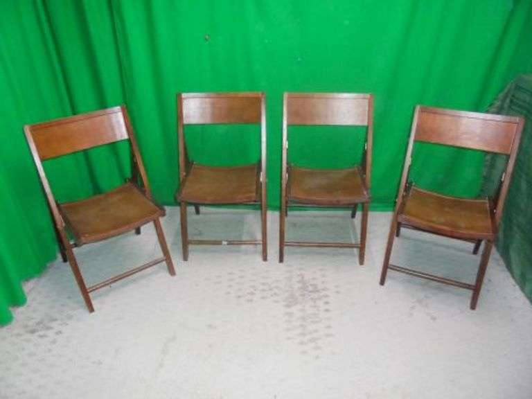 Lot of 4 folding wood chairs. Texas Online Auction House