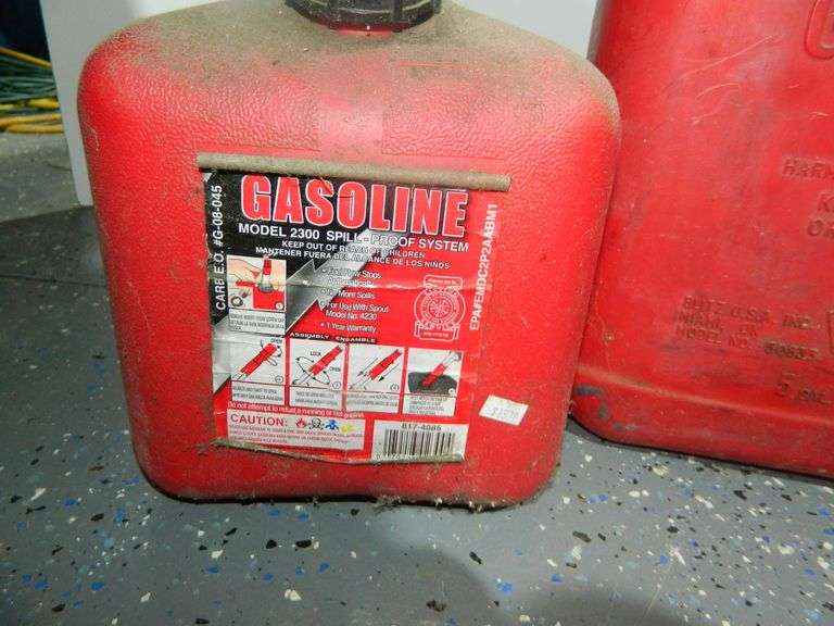 15 gallon & 12 gallon Gas Containers Wolfe Auction & Realty, LLC