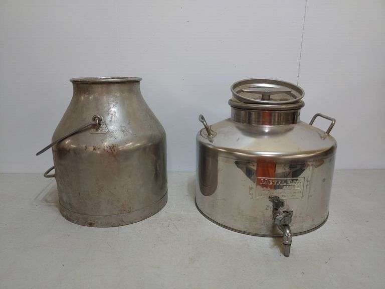 Two stainless steel milk containers. W. Yoder Auction