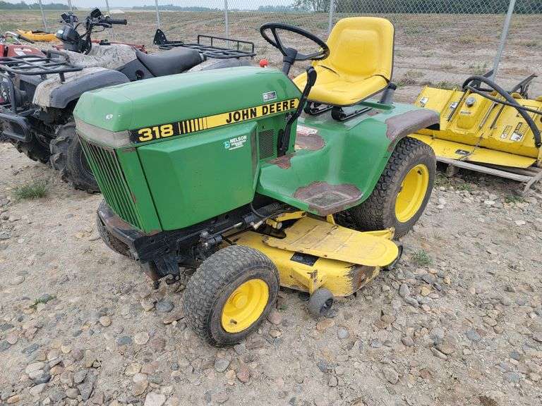 John Deere 318 Garden Tractor, Mower, and Tiller Yorkton Auction Centre