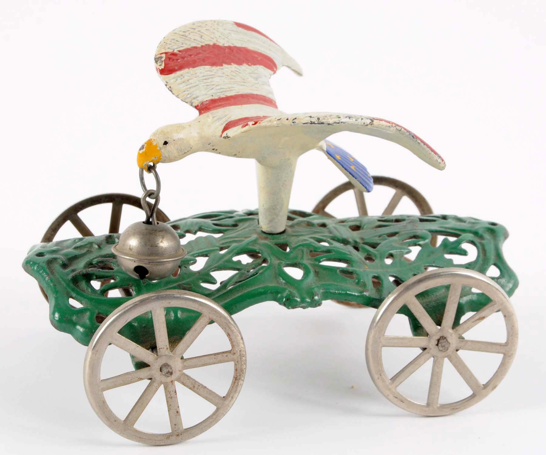 Lot Detail CAST IRON EAGLE BELL TOY ON ORNATE CAST BASE.