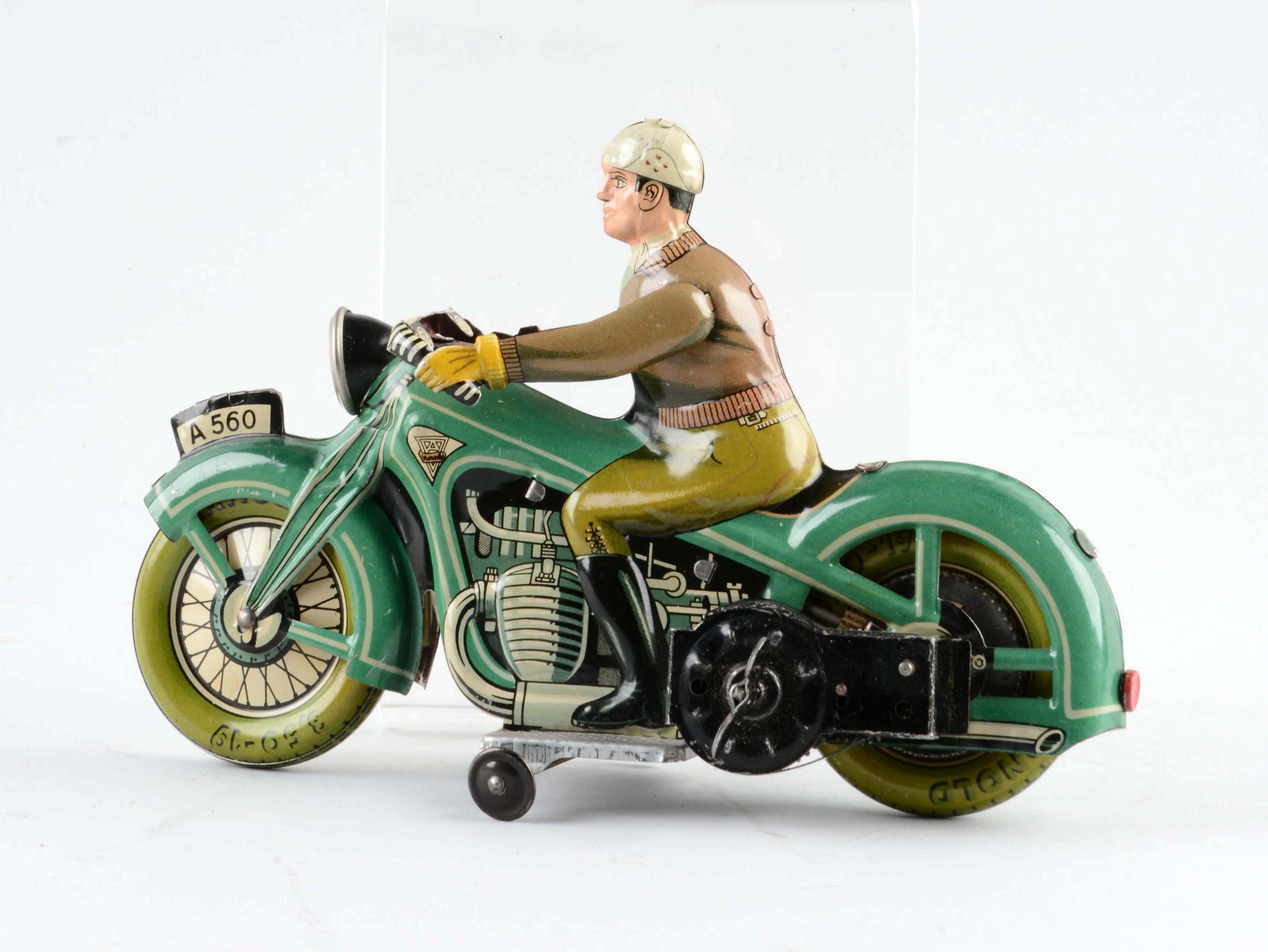 German Arnold Tin Litho Wind Up Motorcycle Toy. auctions & price archive