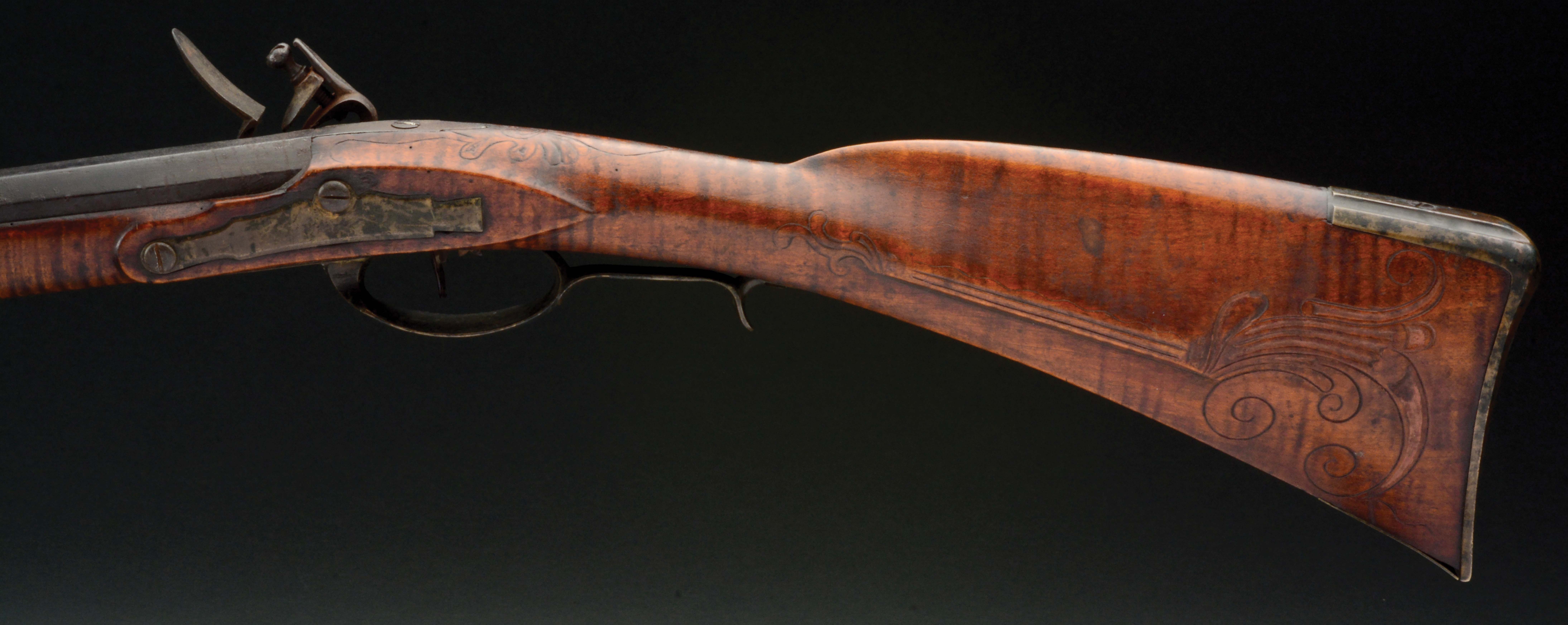 Lot Detail (A) FINE CARVED FLINTLOCK RIFLE ATTRIBUTED TO HENRY MAUGER.