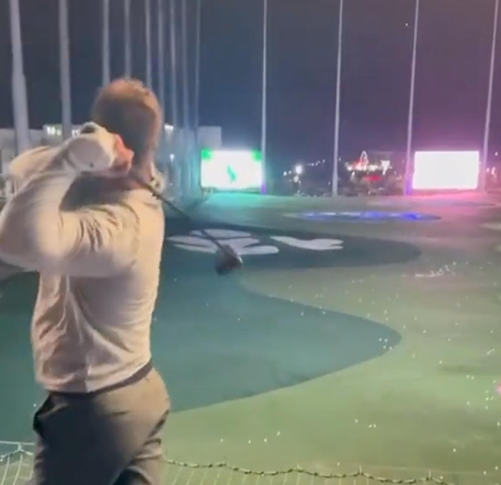 Bryson DeChambeau smashes golf ball over the net at Topgolf, continues