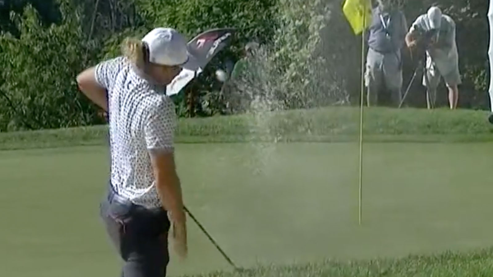 WATCH Hoffman's golf ball hits his hat after bunker shot but