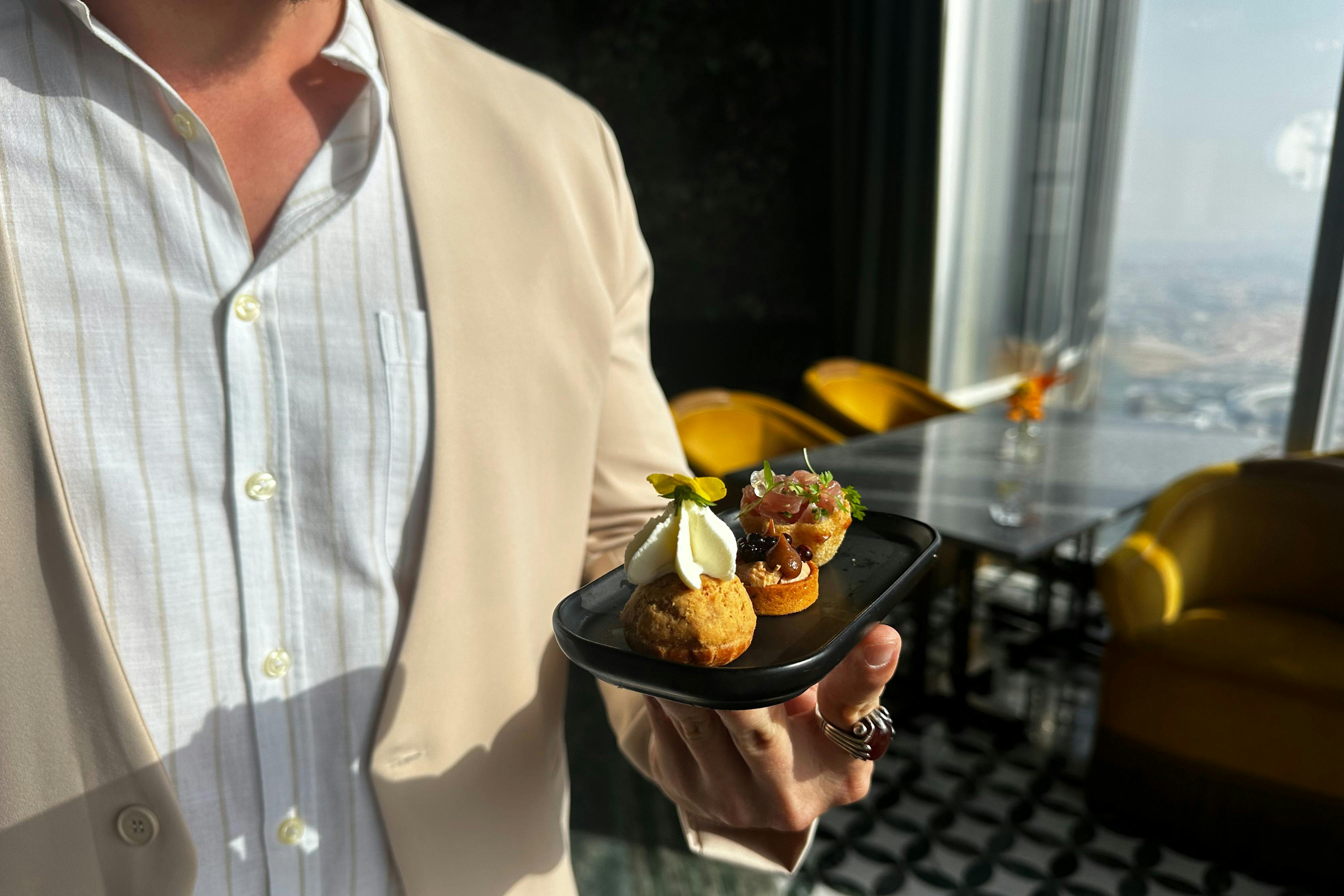 Canapes at the Floor 122 of Burj Khalifa - the tallest building on earth - The supplier offers private access included on tou