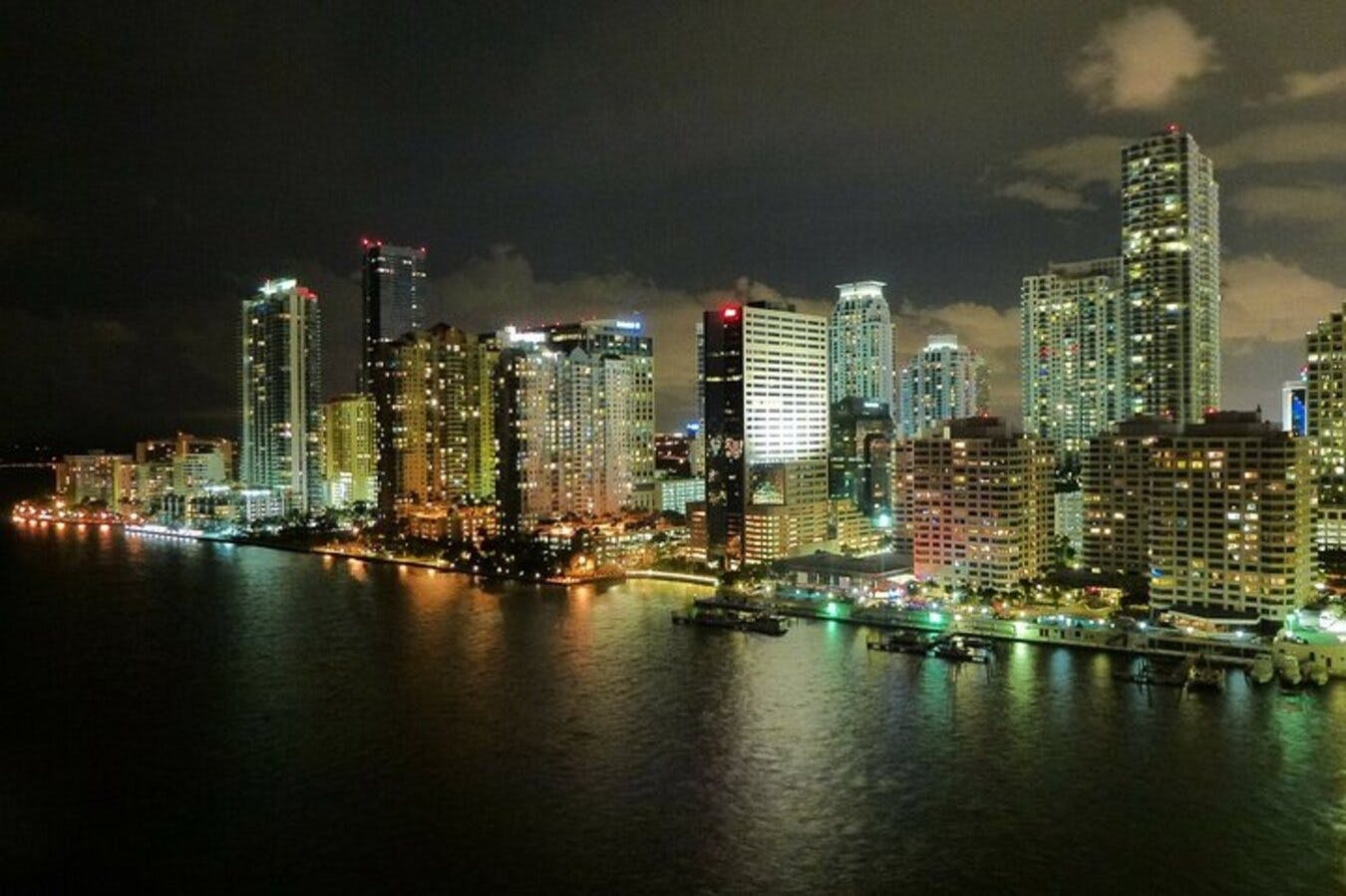 A captivating city skyline lit up by vibrant lights against the dark sky.