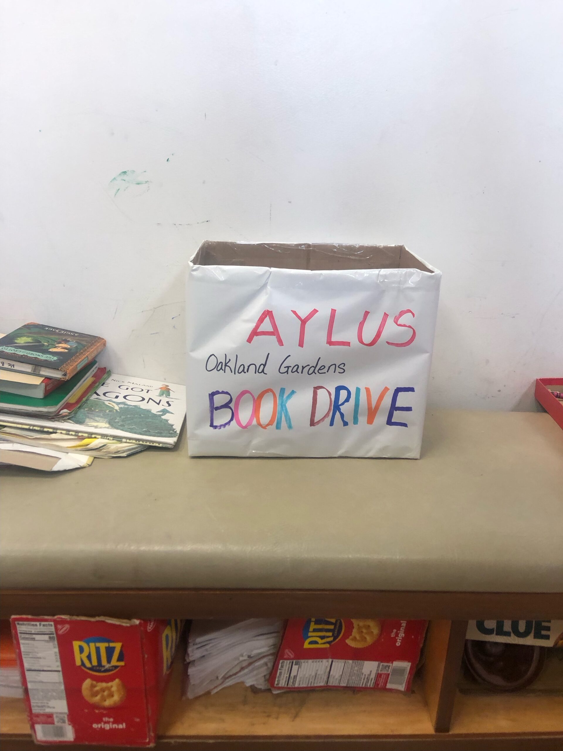 AYLUS Oakland Gardens set up a book drop off box at Chelsea Art School