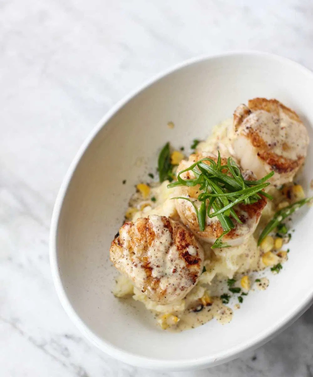 Pan Seared Scallops, White Cheddar Grits and Creole Cream Sauce