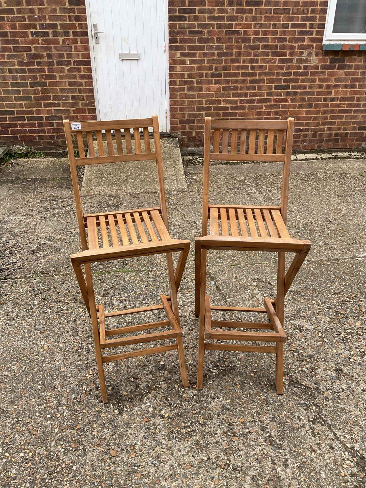 Pair of tall folding wooden garden chairs Badgers Auctions Onsite