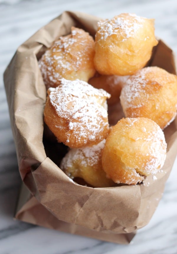 A bag full of fried beignets