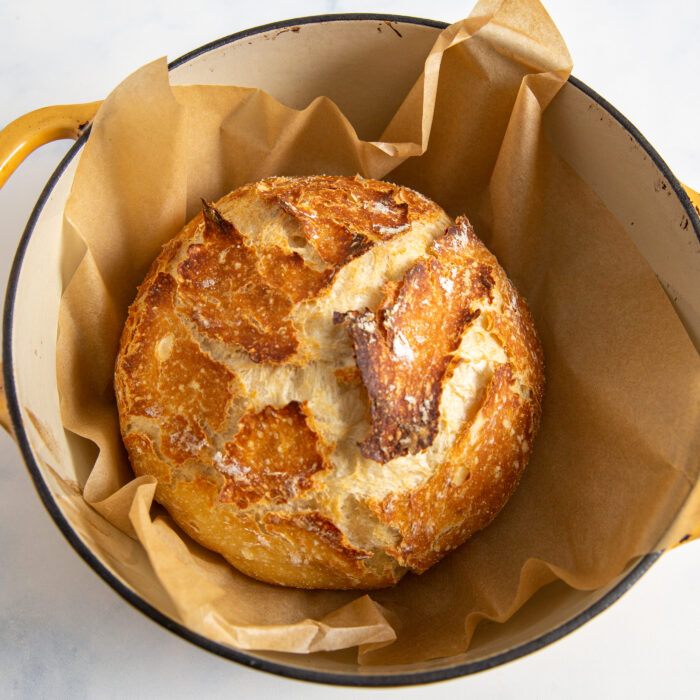 baked bread boule in a dutch oven