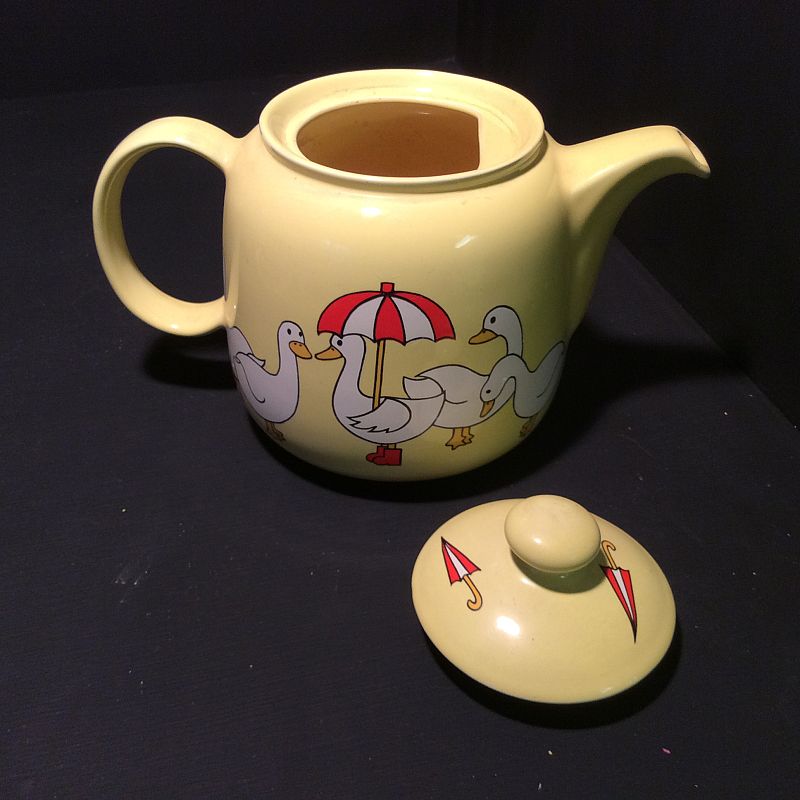 A superb " geese or ducks with umbrellas " hand decorated yellow