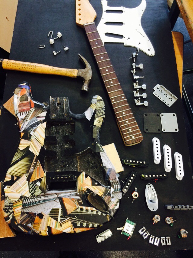 Mixed collage with electric guitar disassembly development and