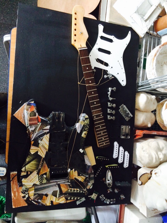 Mixed collage with electric guitar disassembly development and