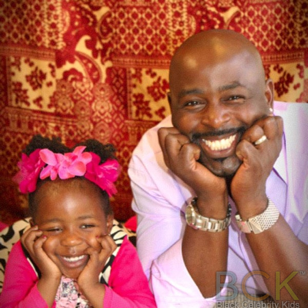 A FAMILY PORTRAIT ALIMI BALLARD, WIFE, AND KIDS