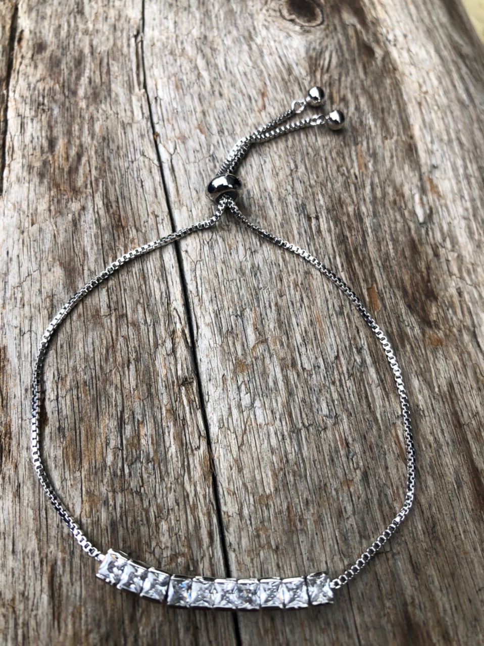 Silver Bracelet with an adjustable sliding clasp and sparkling clear