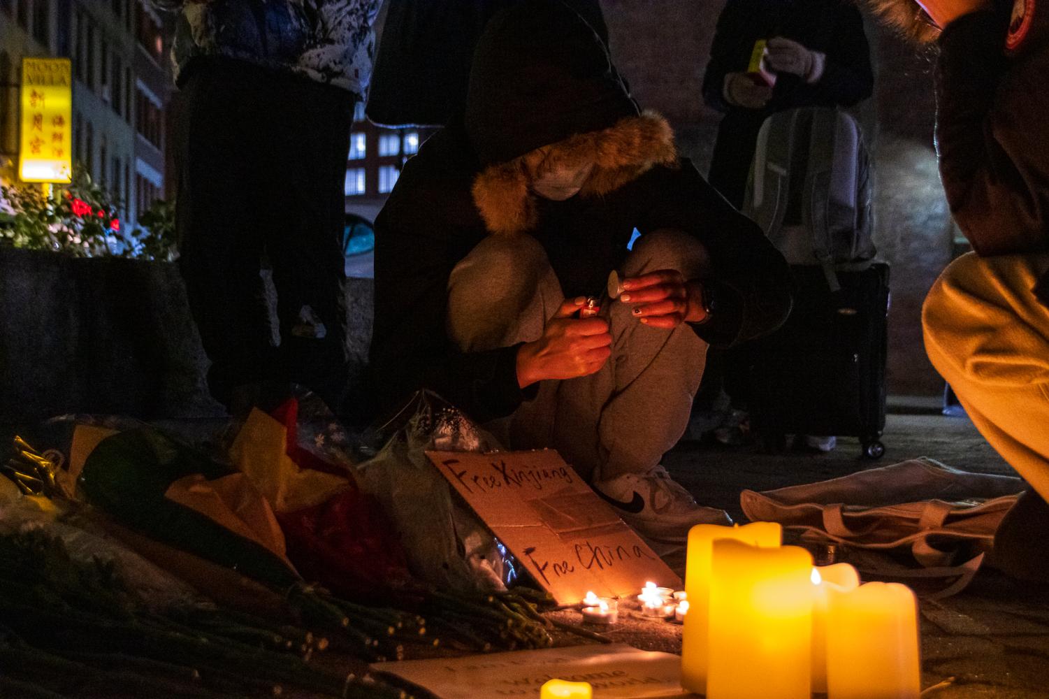 Photos Boston stands with Ürümqi, hundreds gather for candlelight