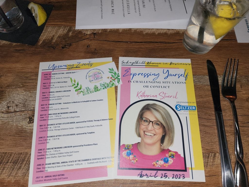 The author's headshot in a program at Business Luncheon where she was speaking