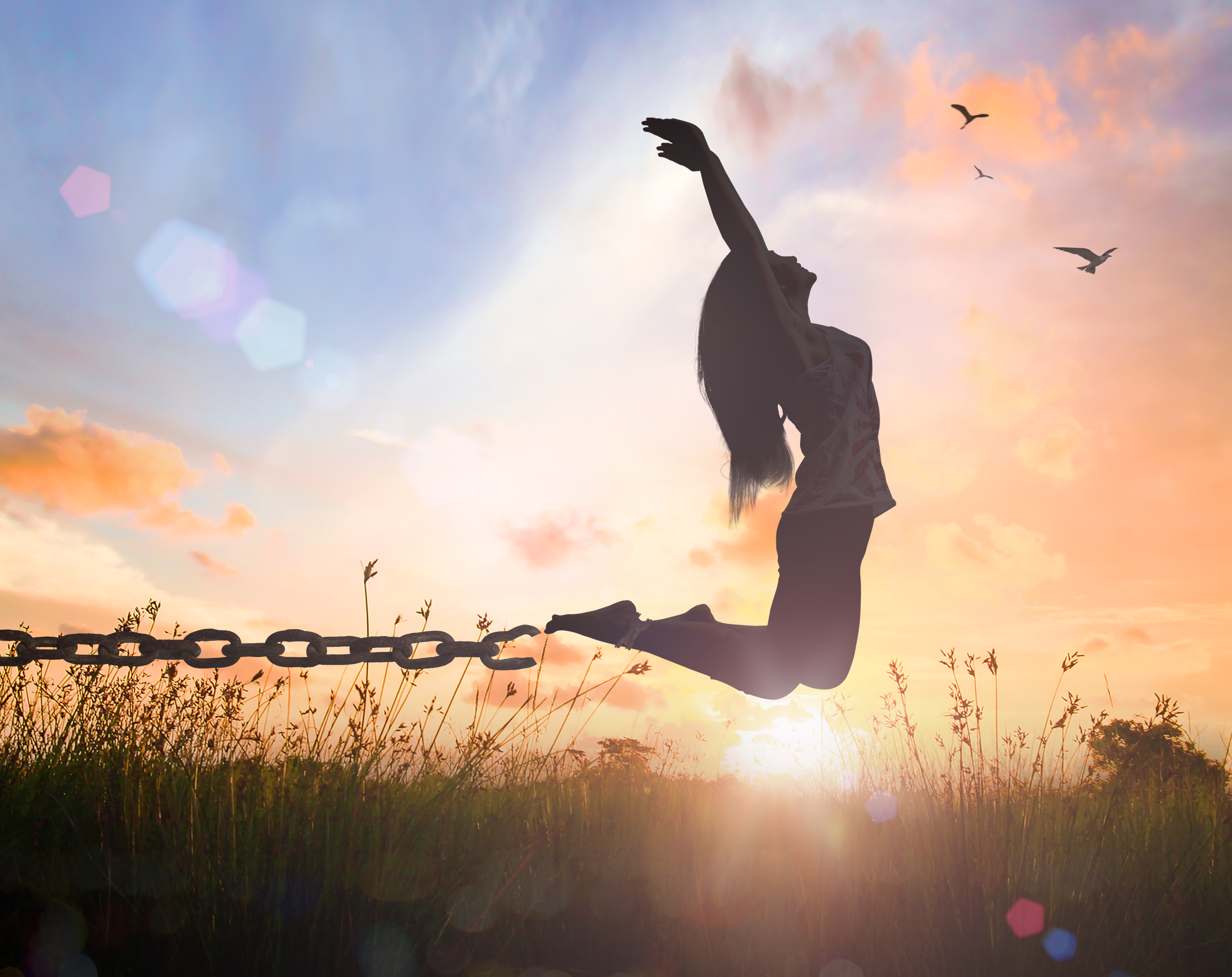 World mental health day concept Silhouette of a woman jumping and