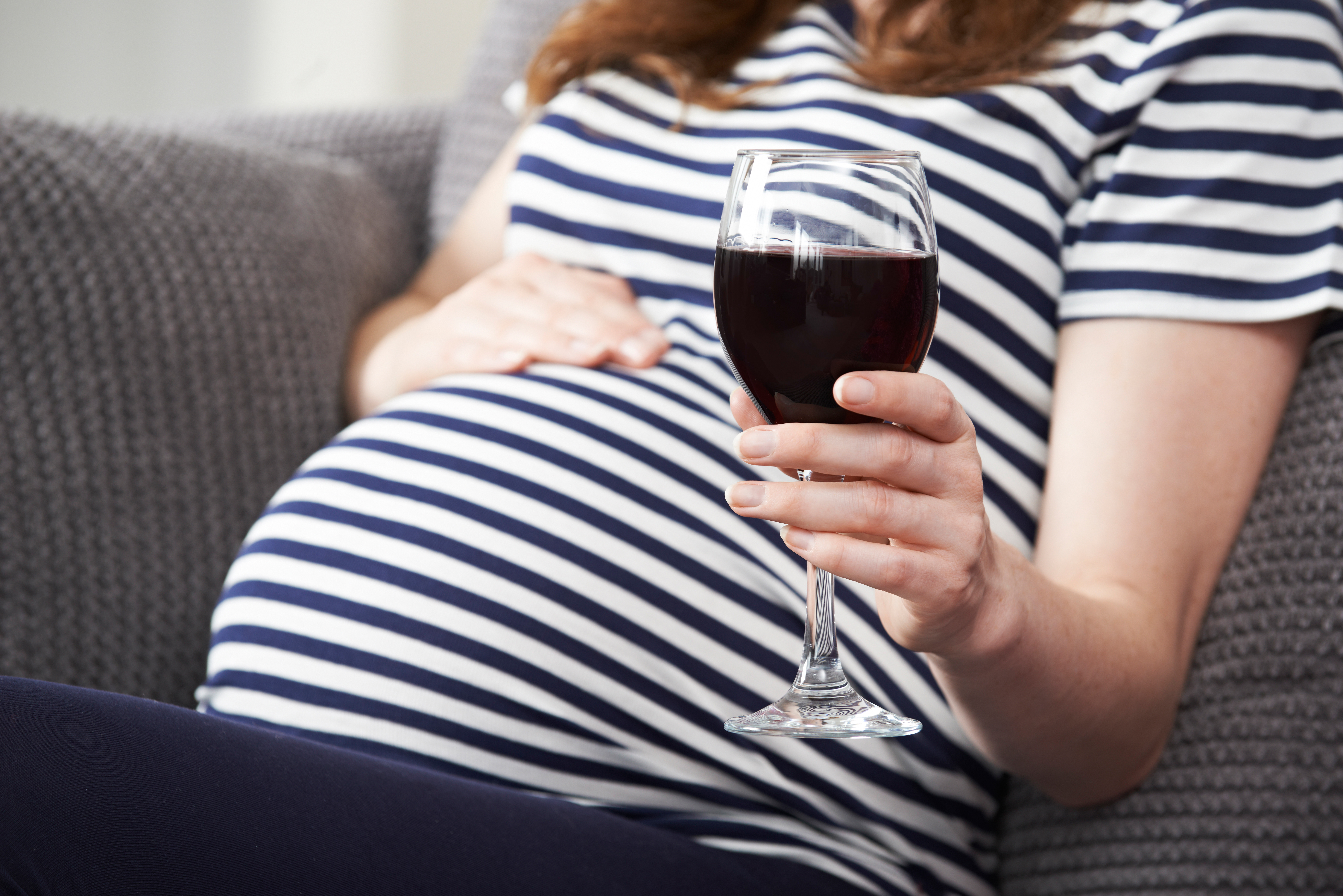 Close Up Of Pregnant Woman Drinking Red Wine Center for Better Beginnings