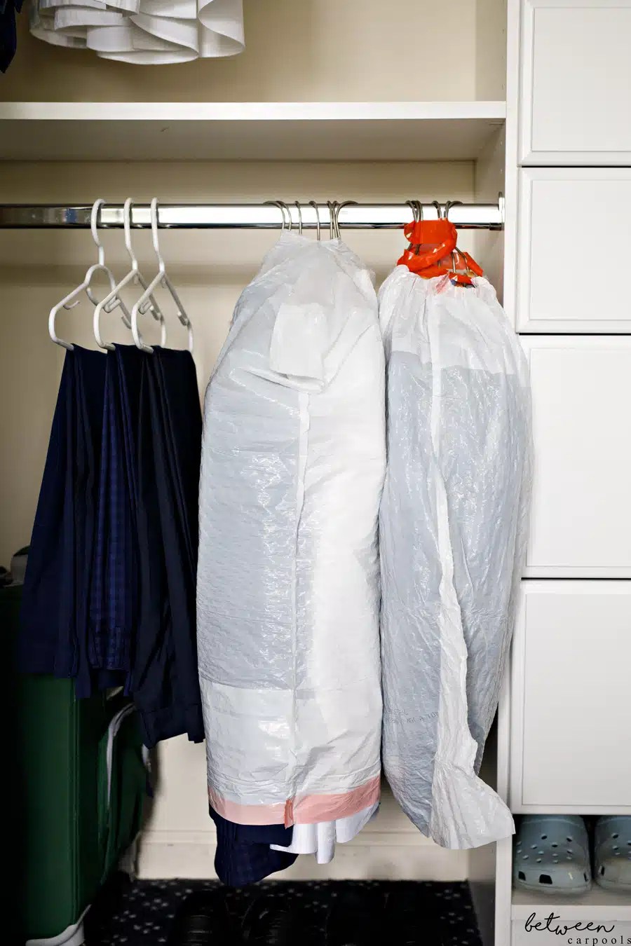 You'll Love This Garment Bag Hack When Packing Between Carpools