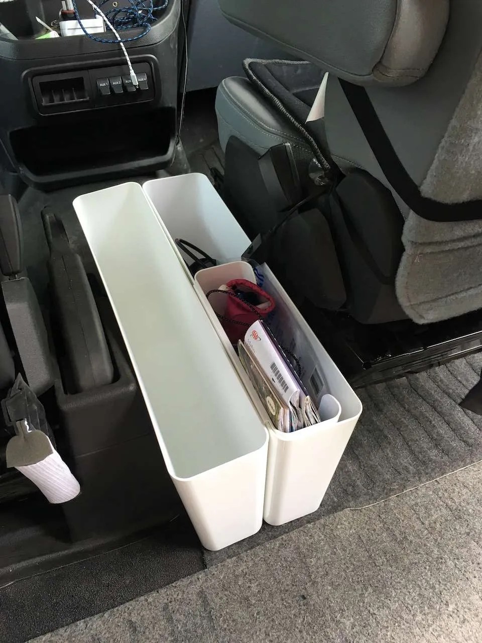 Ikea containers double as document storage between front seats Beyond
