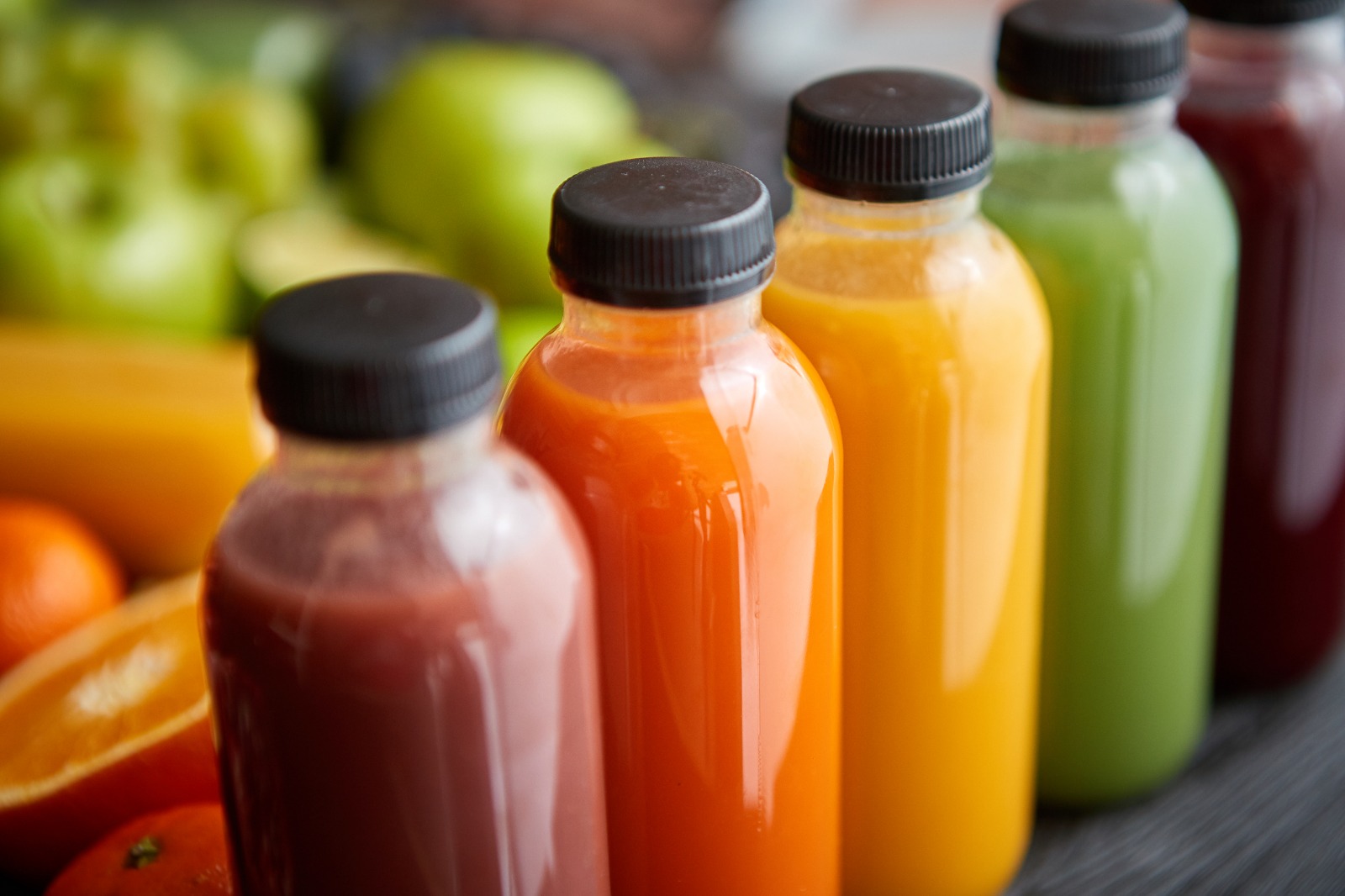 Compostable juice bottles. HPP juice. A Plantbased product in a plant