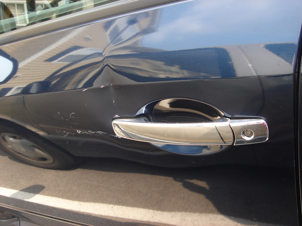 REFRIGERATOR DENT REMOVAL. REFRIGERATOR DENT ABOVE REFRIGERATOR